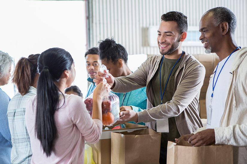 food bank volunteers handing food to others