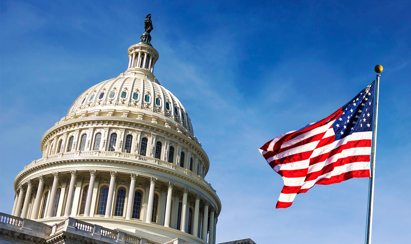 American flag waving on Capitol Hill. 