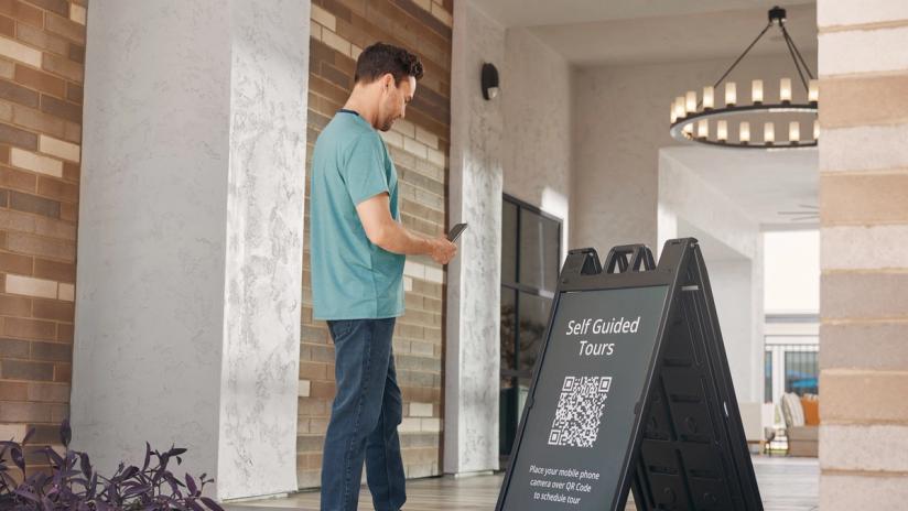 Prospective renter uses SmartRent's self-guided tour app to tour a multifamily community.