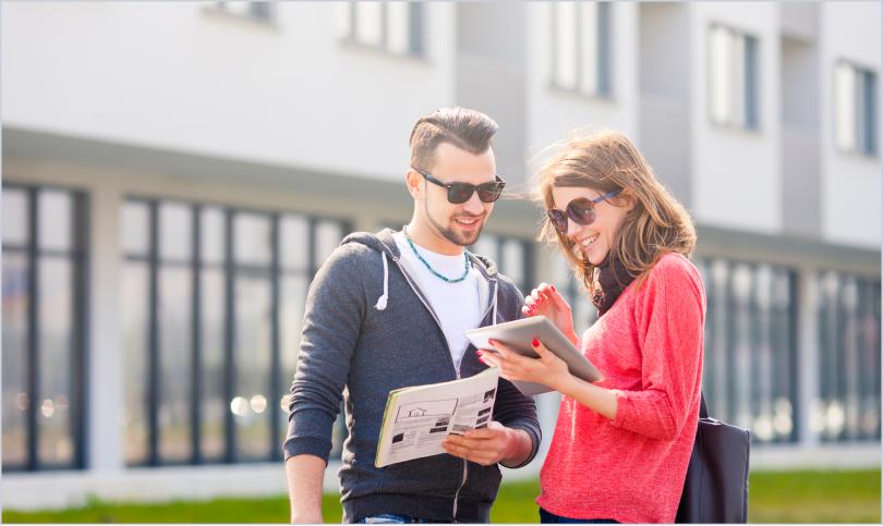 couple touring apartment community