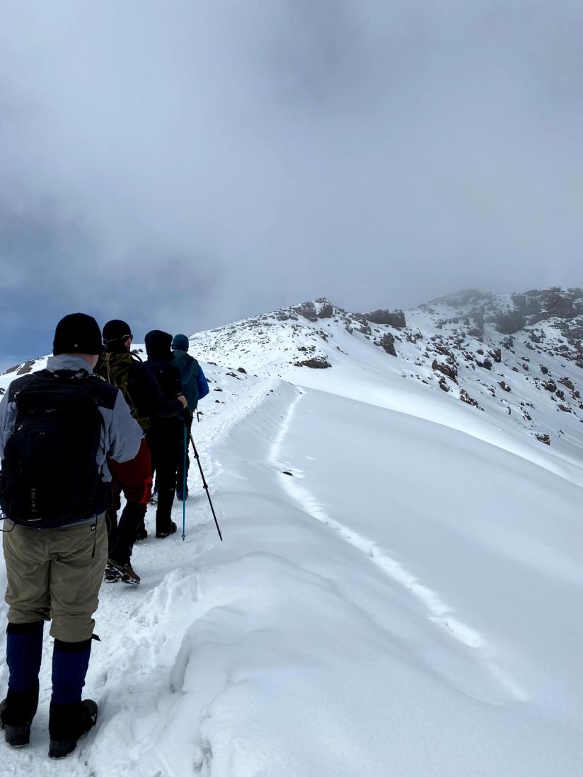 SmartRent employees trek through snow at Mount Kilimanjaro