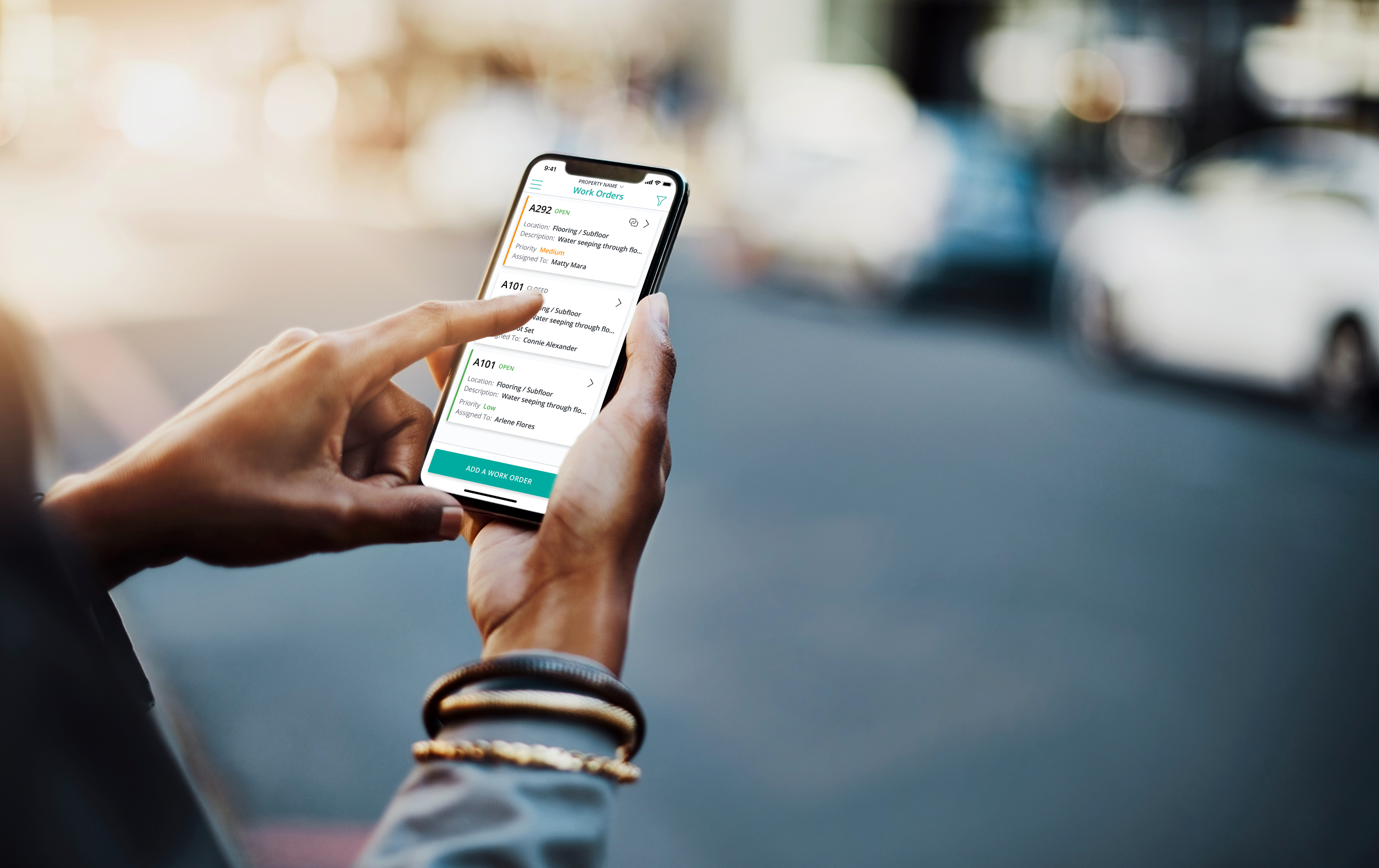person holding phone using SmartRent Community Manager app