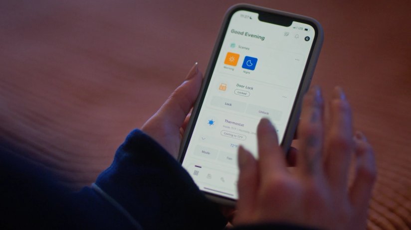Apartment resident uses the SmartRent app to personalize their home