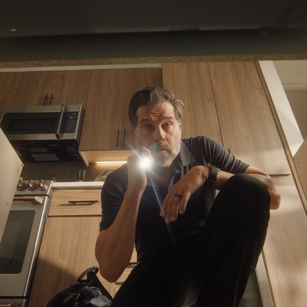 Multifamily maintenance supervisor checks on a leak sensor alert